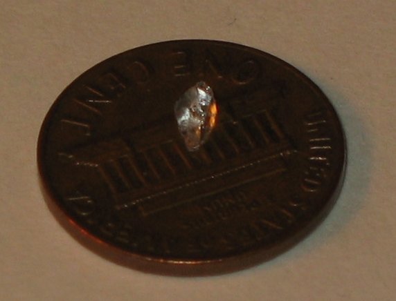Glass Chunk on a Penny for scale